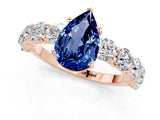 Rose gold Pear Cut Blue Sapphire Prong Setting with Side Stones on a Pave Band_1