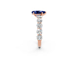 Rose gold Pear Cut Blue Sapphire Prong Setting with Side Stones on a Pave Band_2