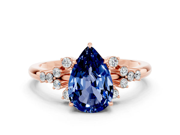 Rose gold Pear Cut Blue Sapphire Ring with Side Stones and Four-Prong Setting
