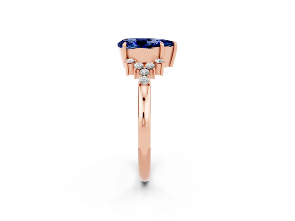 Rose gold Pear Cut Blue Sapphire Ring with Side Stones and Four-Prong Setting