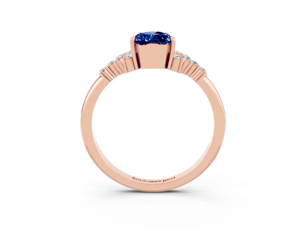 Rose gold Pear Cut Blue Sapphire Ring with Side Stones and Four-Prong Setting