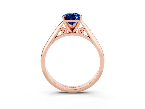 Rose gold Pear Cut Blue Sapphire Solitaire Engagement Ring with Cathedral Setting and Four-Prong Mount