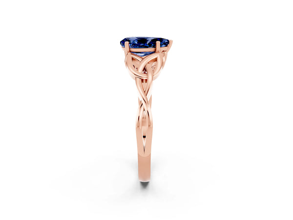 Rose gold Pear Cut Blue Sapphire Solitaire Engagement Ring with Celtic Knot Band and Four-Prong Setting