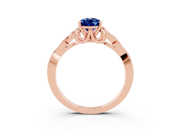 Rose gold Pear Cut Blue Sapphire Solitaire Engagement Ring with Celtic Knot Band and Four-Prong Setting