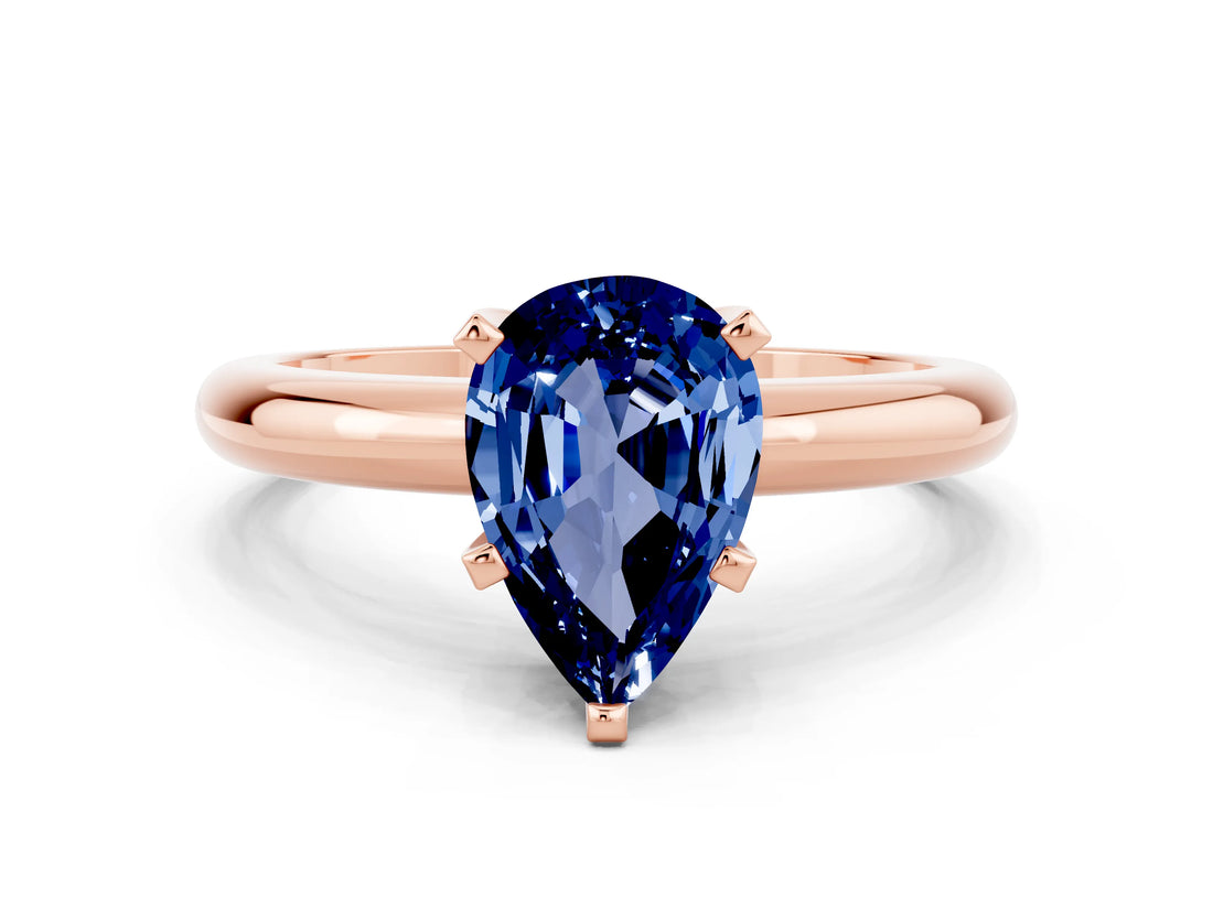 Rose gold Pear Cut Blue Sapphire Solitaire Engagement Ring with Round Band and Four-Prong Setting