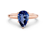 Rose gold Pear Cut Blue Sapphire Solitaire Engagement Ring with Round Band and Four-Prong Setting