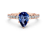 Rose gold Pear Cut Blue Sapphire Solitaire Pavé Engagement Ring with Round Band and Prong Setting_12
