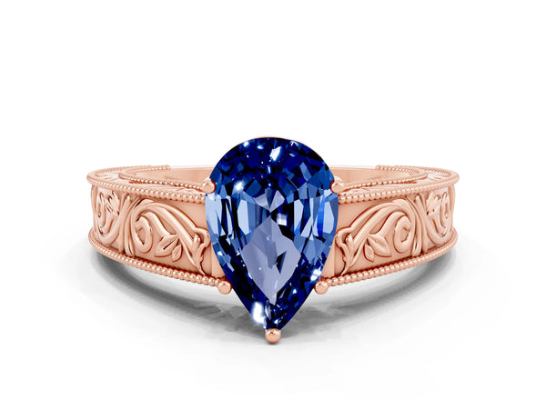 Rose gold Pear Cut Blue Sapphire Solitaire Ring with Engraved Band and Four-Prong Setting