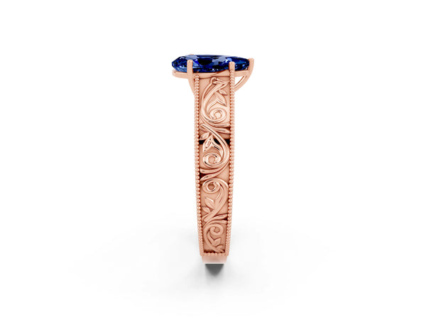 Rose gold Pear Cut Blue Sapphire Solitaire Ring with Engraved Band and Four-Prong Setting