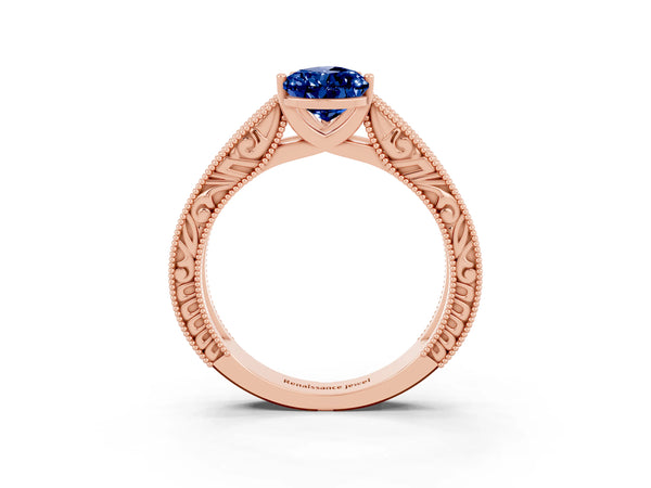 Rose gold Pear Cut Blue Sapphire Solitaire Ring with Engraved Band and Four-Prong Setting