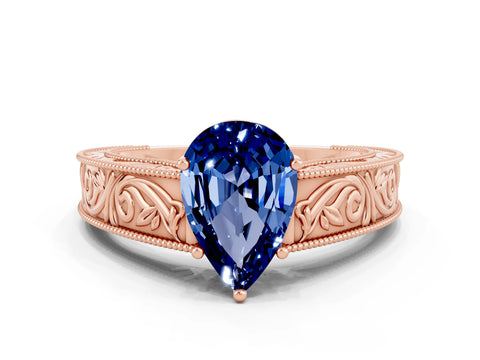 Rose gold Pear Cut Blue Sapphire Solitaire Ring with Engraved Band and Four-Prong Setting