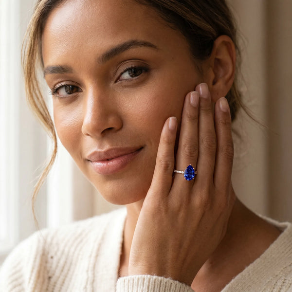 Rose gold Pear Cut Blue Sapphire Solitaire Ring with Round  Pavé Band and Four-Prong Setting