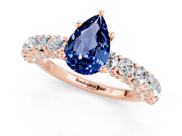 Rose gold Pear Cut Blue Sapphire Solitaire Ring with Shared Prong Pavé Band and Four-Prong Setting