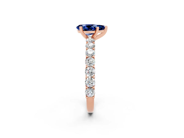 Rose gold Pear Cut Blue Sapphire Solitaire Ring with Shared Prong Pavé Band and Four-Prong Setting