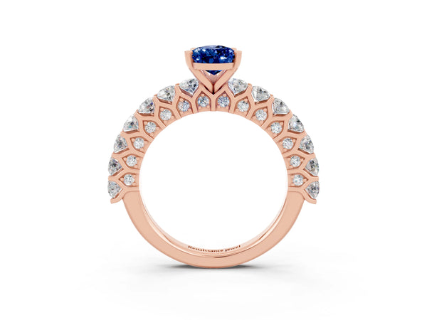 Rose gold Pear Cut Blue Sapphire Solitaire Ring with Shared Prong Pavé Band and Four-Prong Setting