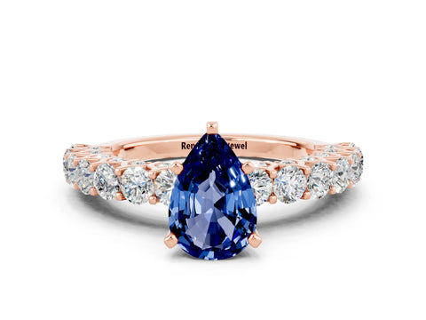 Rose gold Pear Cut Blue Sapphire Solitaire Ring with Shared Prong Pavé Band and Four-Prong Setting