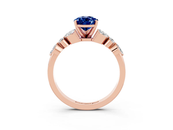 Rose gold Pear Cut Blue Sapphire Solitaire Ring with Side Stones and Four-Prong Setting
