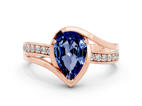 Rose gold Pear Cut Blue Sapphire Solitaire Ring with Split Shank and Prong Setting
