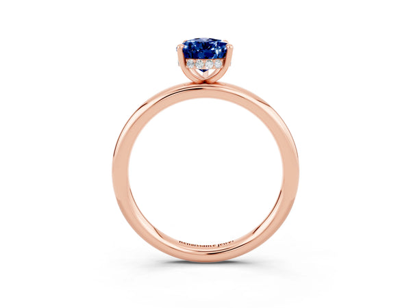 Rose gold Pear Cut Blue Sapphire Solitaire Ring with Thin Band and Four-Prong Setting