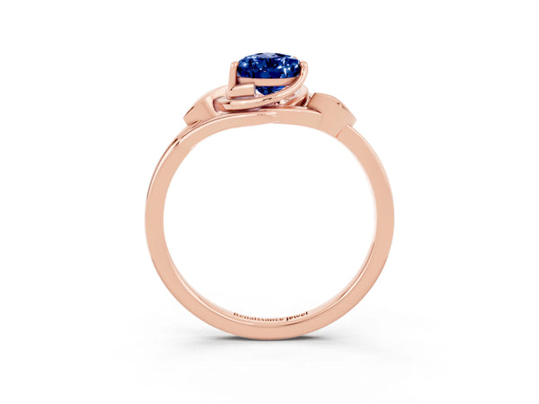 Rose gold Pear Cut Blue Sapphire Solitaire Ring with Twist Band and Four-Prong Setting