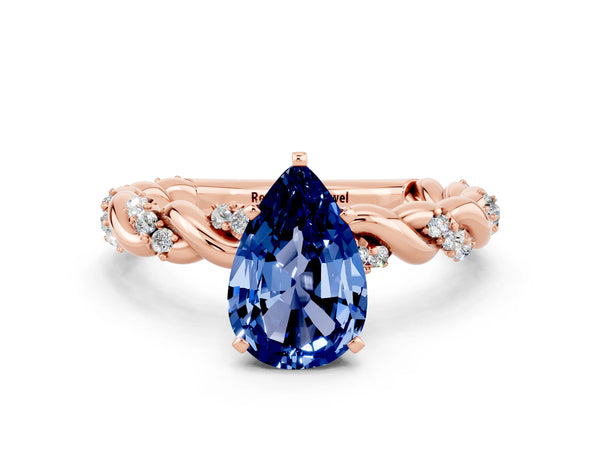 Rose gold Pear Cut Blue Sapphire Solitaire Ring with Twisted Band and Pavé Accents