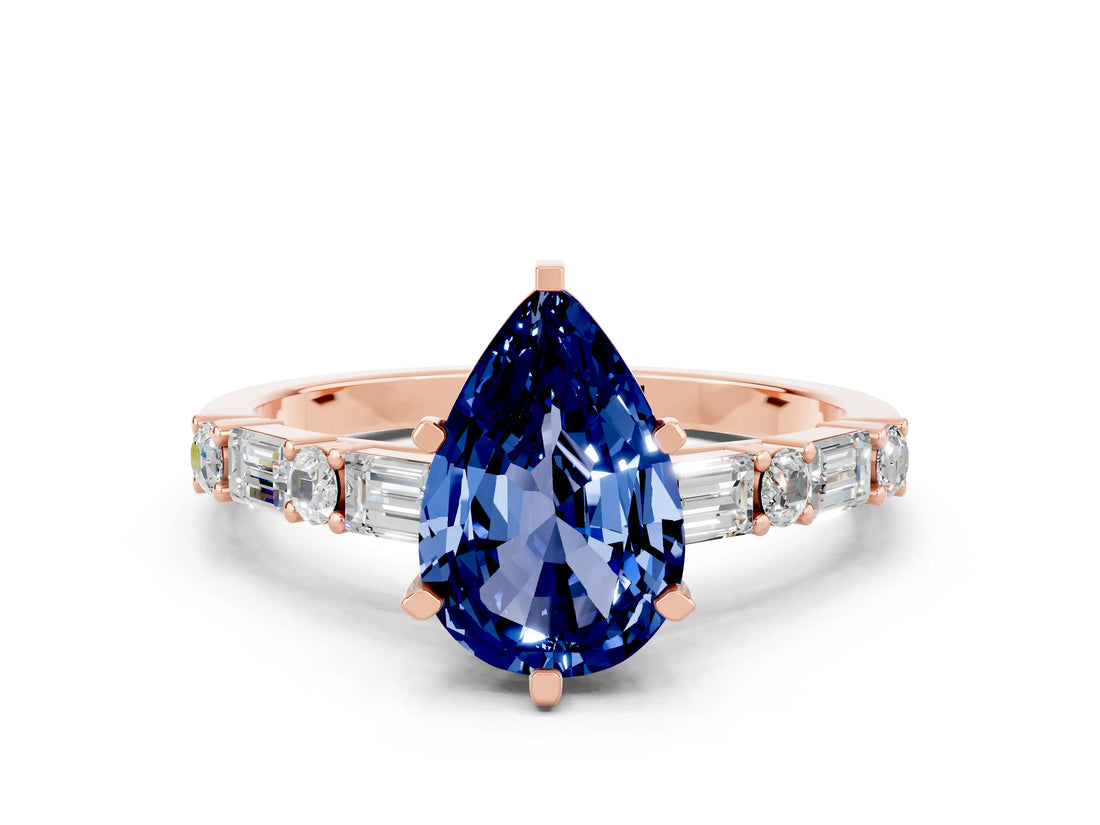 Rose gold Pear Cut Blue Sapphire Solitaire with Side Baguettes and Channel Set Band