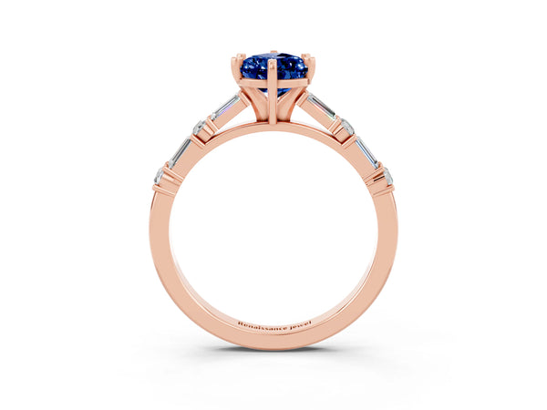 Rose gold Pear Cut Blue Sapphire Solitaire with Side Baguettes and Channel Set Band