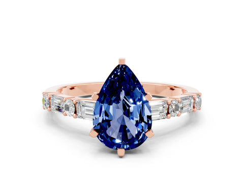 Rose gold Pear Cut Blue Sapphire Solitaire with Side Baguettes and Channel Set Band