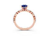 Rose gold Pear Cut Blue Sapphire Solitaire with Side Stones on a Pavé Band and Four-Prong Setting_3