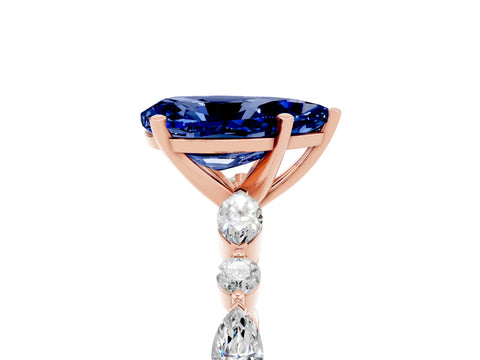 Rose gold Pear Cut Blue Sapphire Solitaire with Side Stones on a Pavé Band and Four-Prong Setting_5