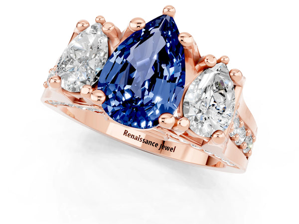 Rose gold Pear Cut Blue Sapphire Three-Stone Ring with Channel Set Band and Four-Prong Setting