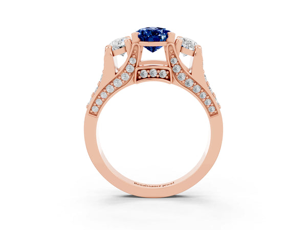 Rose gold Pear Cut Blue Sapphire Three-Stone Ring with Channel Set Band and Four-Prong Setting