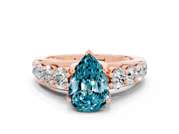 Rose gold Pear Cut Blue Topaz Engagement Ring with Pavé Band and Four-Prong Setting