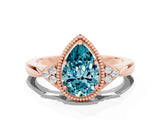 Rose gold Pear Cut Blue Topaz Halo Ring with Tapered Band and Four-Prong Setting