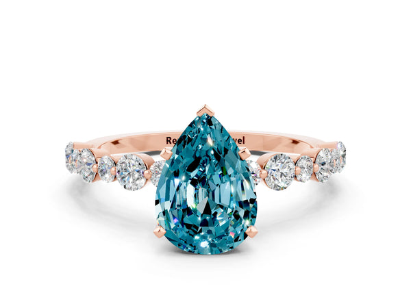 Rose gold Pear Cut Blue Topaz Prong Set Engagement Ring with Pavé Band