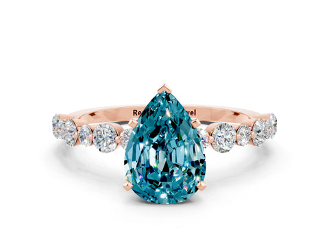 Rose gold Pear Cut Blue Topaz Prong Set Engagement Ring with Pavé Band
