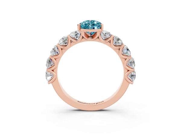 Rose gold Pear Cut Blue Topaz Prong Setting with Side Stones on a Pave Band