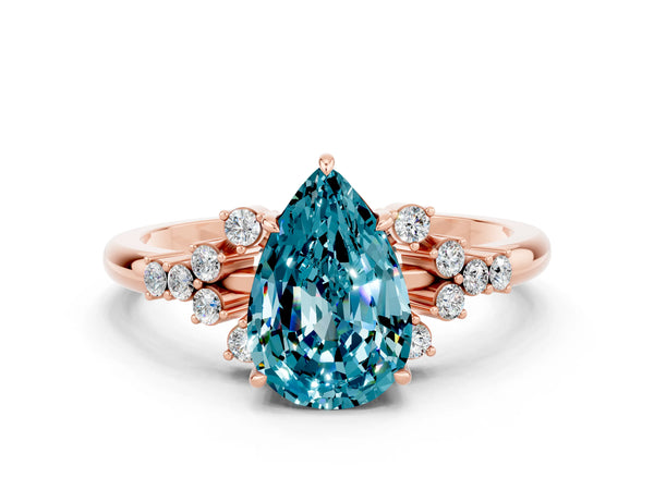 Rose gold Pear Cut Blue Topaz Ring with Side Stones and Four-Prong Setting