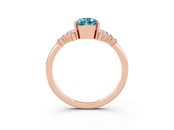 Rose gold Pear Cut Blue Topaz Ring with Side Stones and Four-Prong Setting