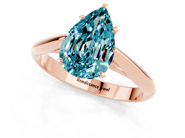Rose gold Pear Cut Blue Topaz Solitaire Engagement Ring with Cathedral Setting and Four-Prong Mount