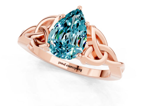Rose gold Pear Cut Blue Topaz Solitaire Engagement Ring with Celtic Knot Band and Four-Prong Setting_1