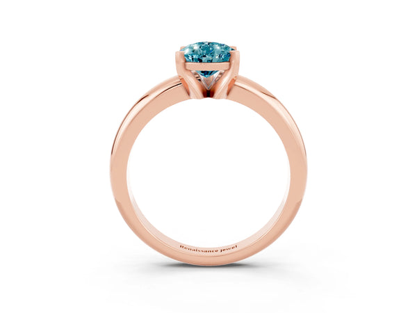 Rose gold Pear Cut Blue Topaz Solitaire Engagement Ring with Round Band and Four-Prong Setting
