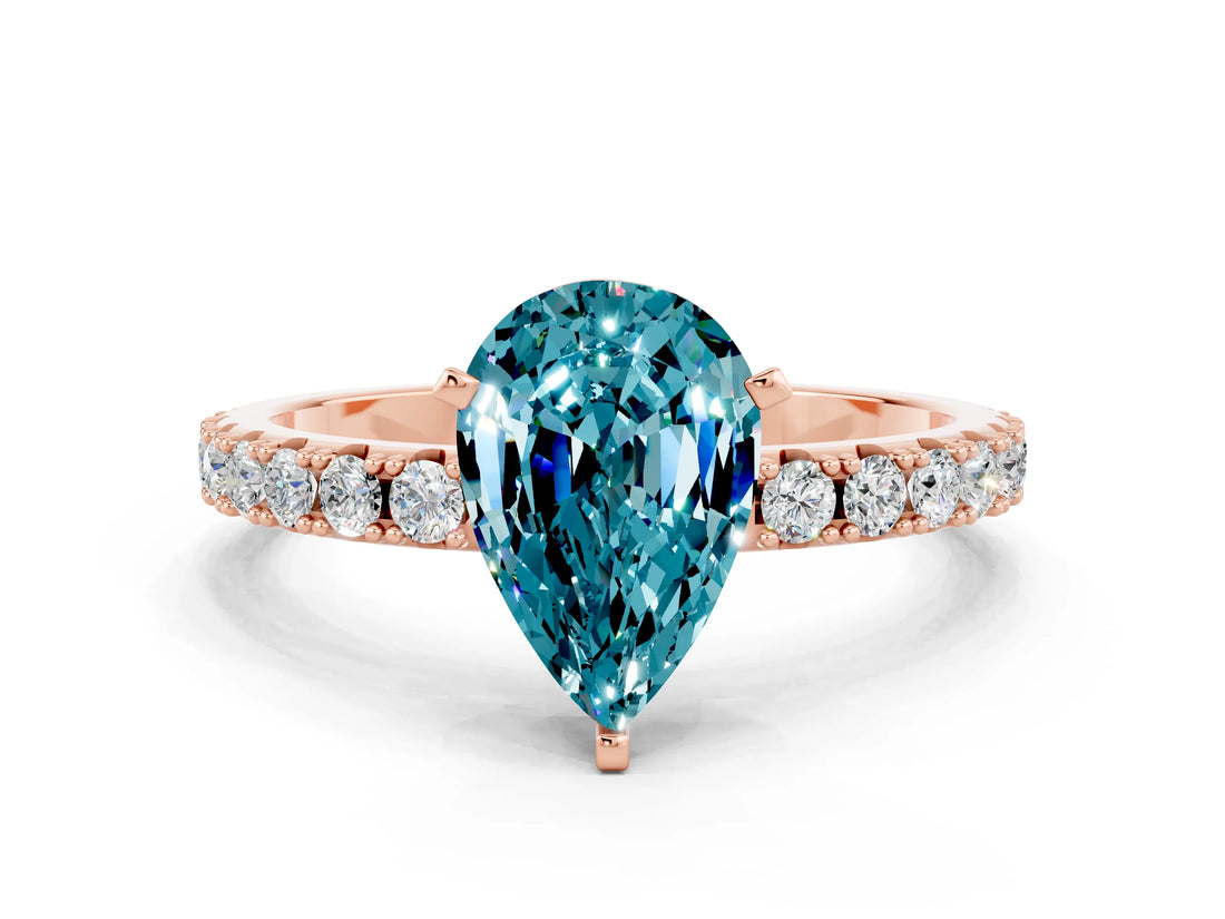 Rose gold Pear Cut Blue Topaz Solitaire Pavé Band with Four-Prong Setting
