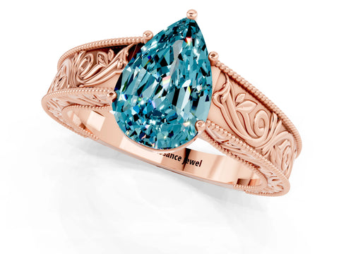 Rose gold Pear Cut Blue Topaz Solitaire Ring with Engraved Band and Four-Prong Setting_1