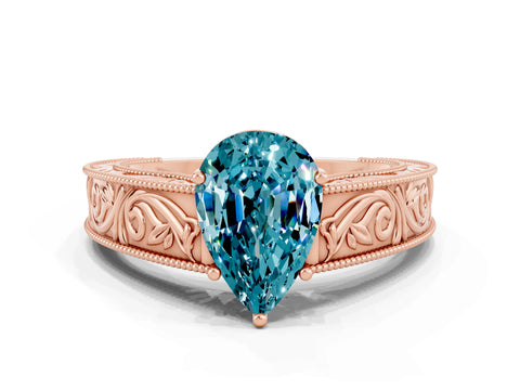 Rose gold Pear Cut Blue Topaz Solitaire Ring with Engraved Band and Four-Prong Setting