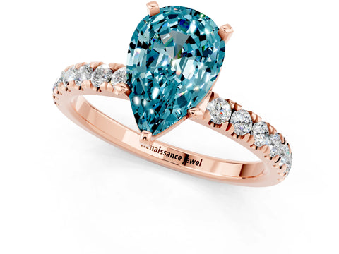 Rose gold Pear Cut Blue Topaz Solitaire Ring with Pavé Accents and Four-Prong Setting_1