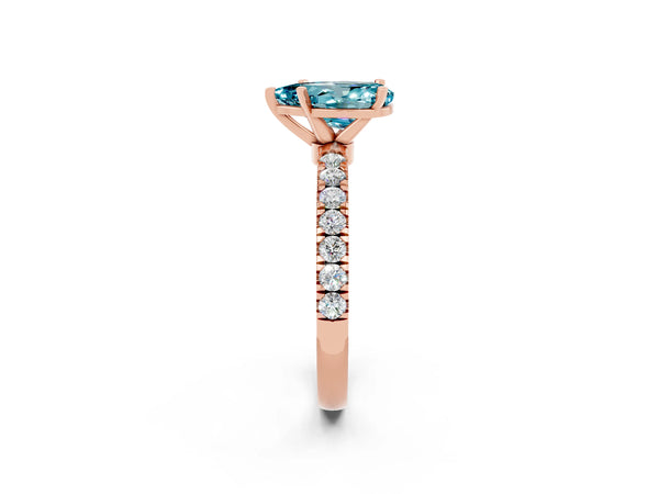 Rose gold Pear Cut Blue Topaz Solitaire Ring with Pavé Accents and Four-Prong Setting