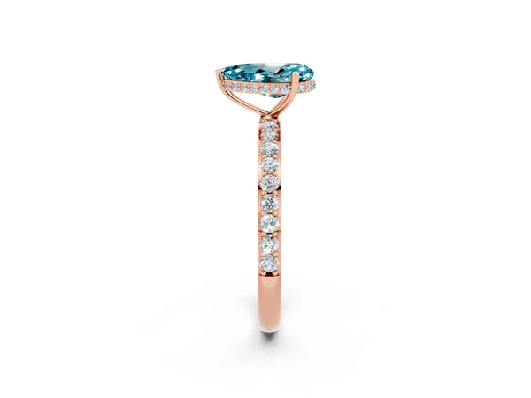 Rose gold Pear Cut Blue Topaz Solitaire Ring with Pavé Band and Hidden Halo