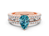 Rose gold Pear Cut Blue Topaz Solitaire Ring with Pavé and Channel Set Band