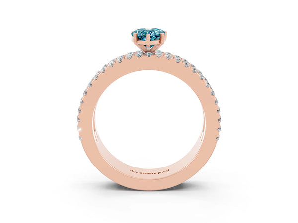 Rose gold Pear Cut Blue Topaz Solitaire Ring with Pavé and Channel Set Band